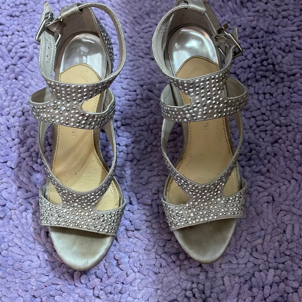 Size 6 1/2 platform heals. Silver Gianni Bini